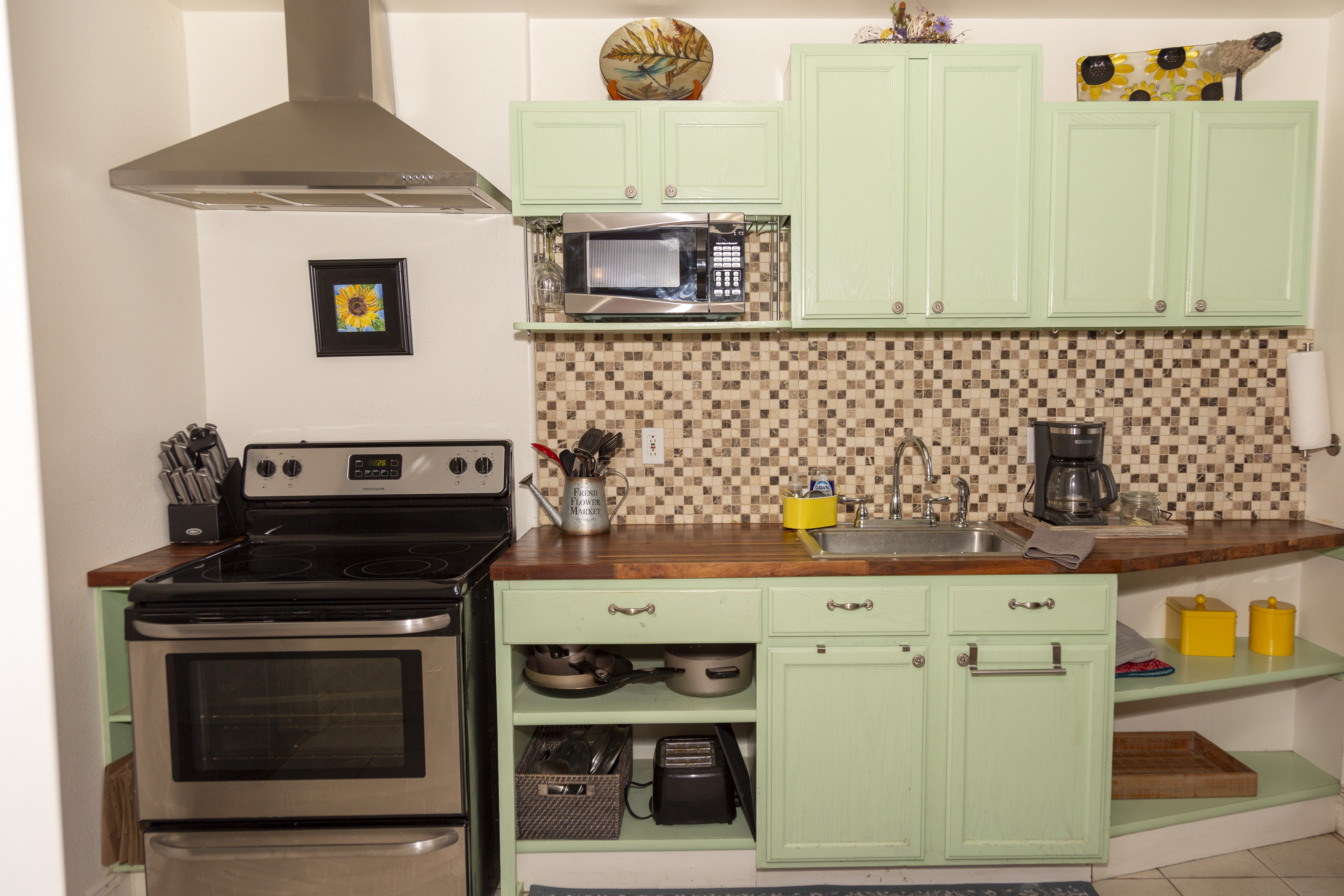 Fully equipped kitchen with modern appliances and plenty of counter space for meal prep.