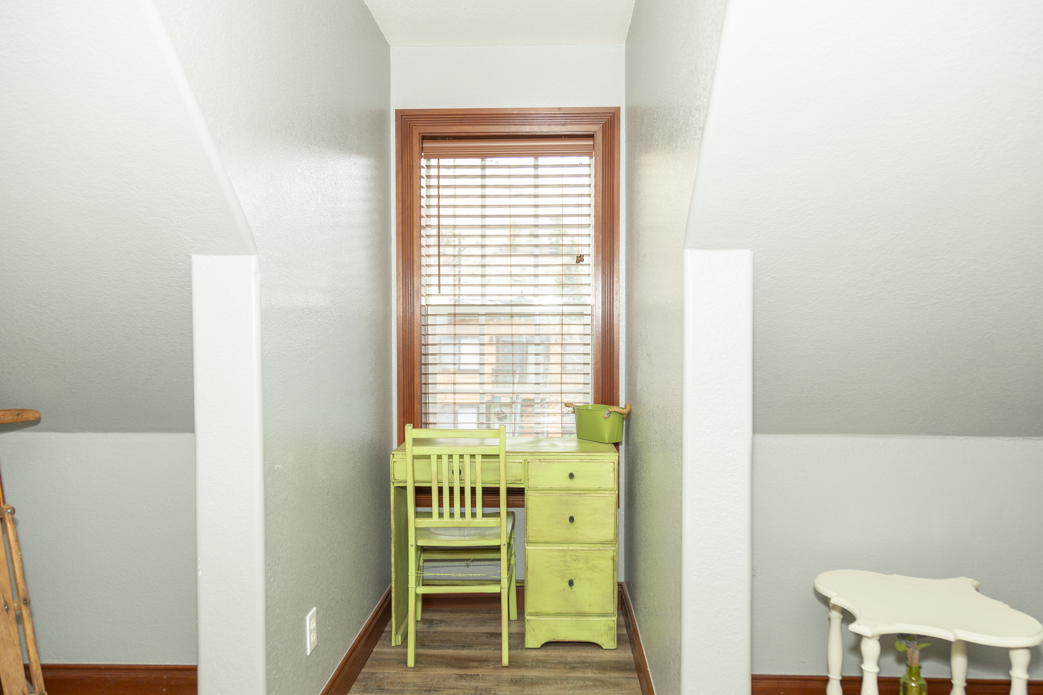 Bunk room with full-over-twin bunk bed, perfect for kids or friends sharing.Full view of the inn with exterior staircase and evening lighting.