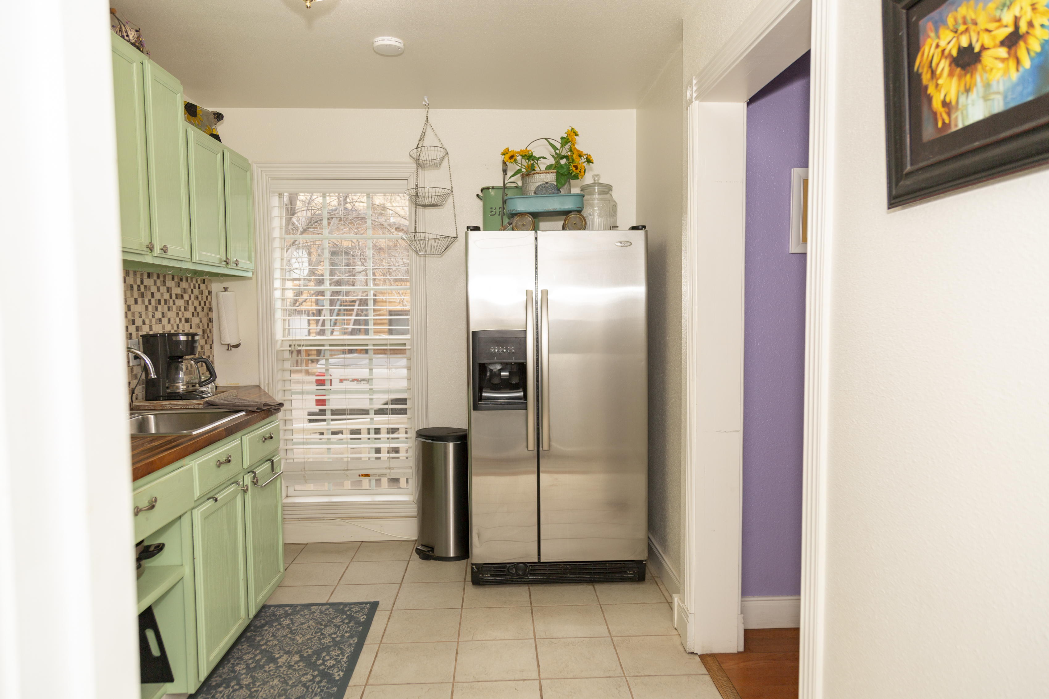 Bedroom with warm wood tones and classic furnishings for a comfortable stay.