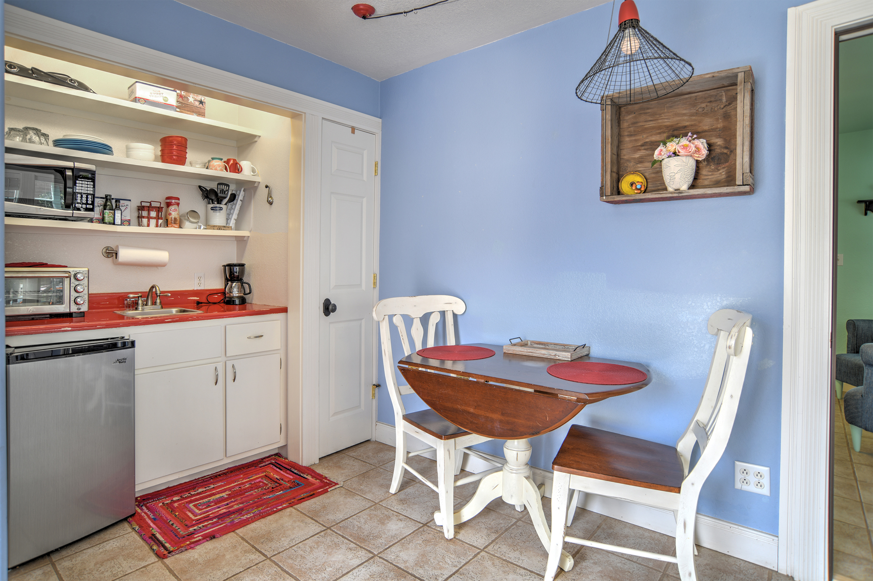 Unit 2, the Rosewood Studio, is a spacious studio featuring a separate living area from the bedroom and kitchenette area. This unit also includes a private bathroom and is conveniently located on the main floor.