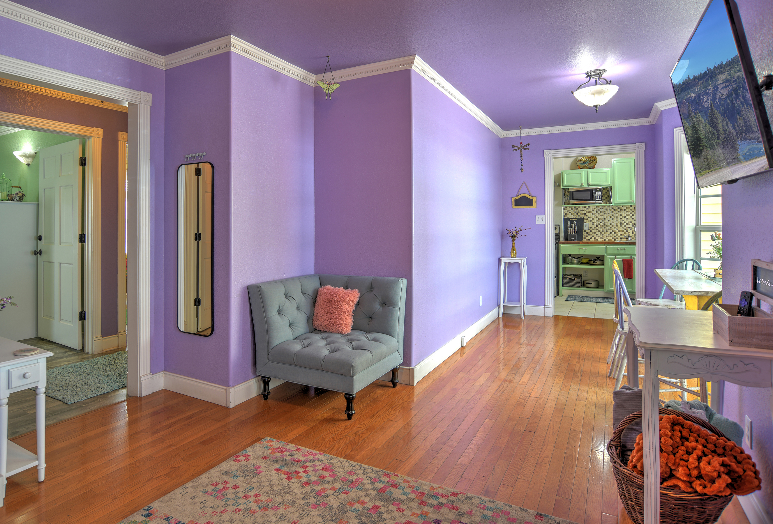 Rose Garden Retreat living room flows seamlessly into the dining area and kitchen.