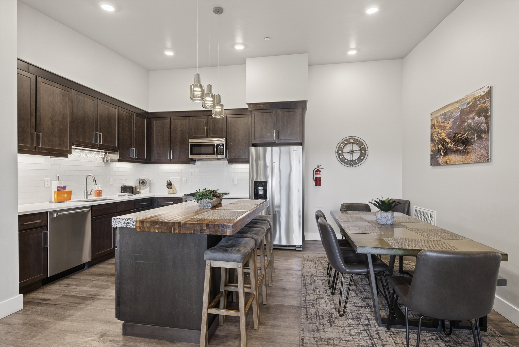 Large dining table and island seating so everyone can enjoy meals together.