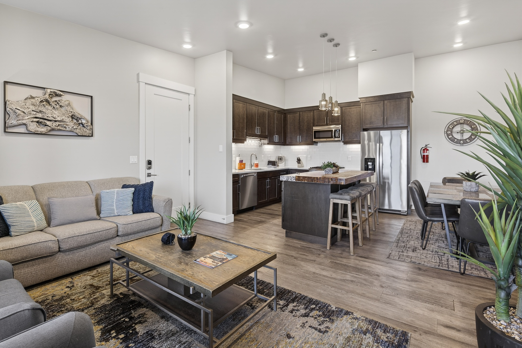 Open kitchen layout that keeps the cook connected to the conversation in the living room.