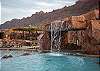 Resort-style oasis at Sage Creek with panoramic red rock cliffs and La Sal Mountain views all around.
