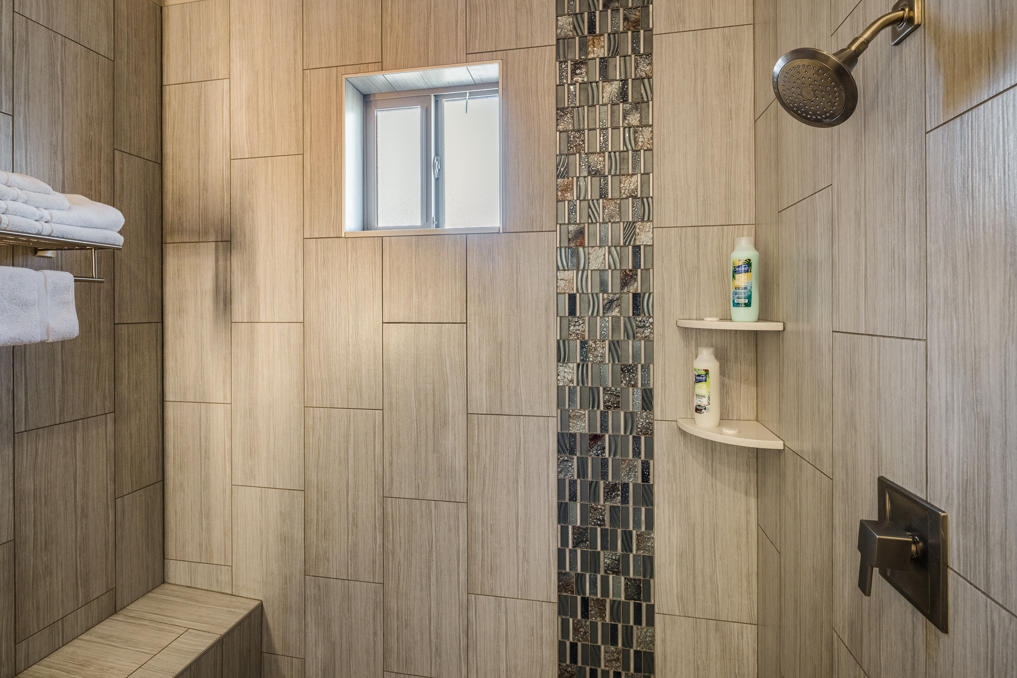 Convenient full bathroom with a walk-in shower