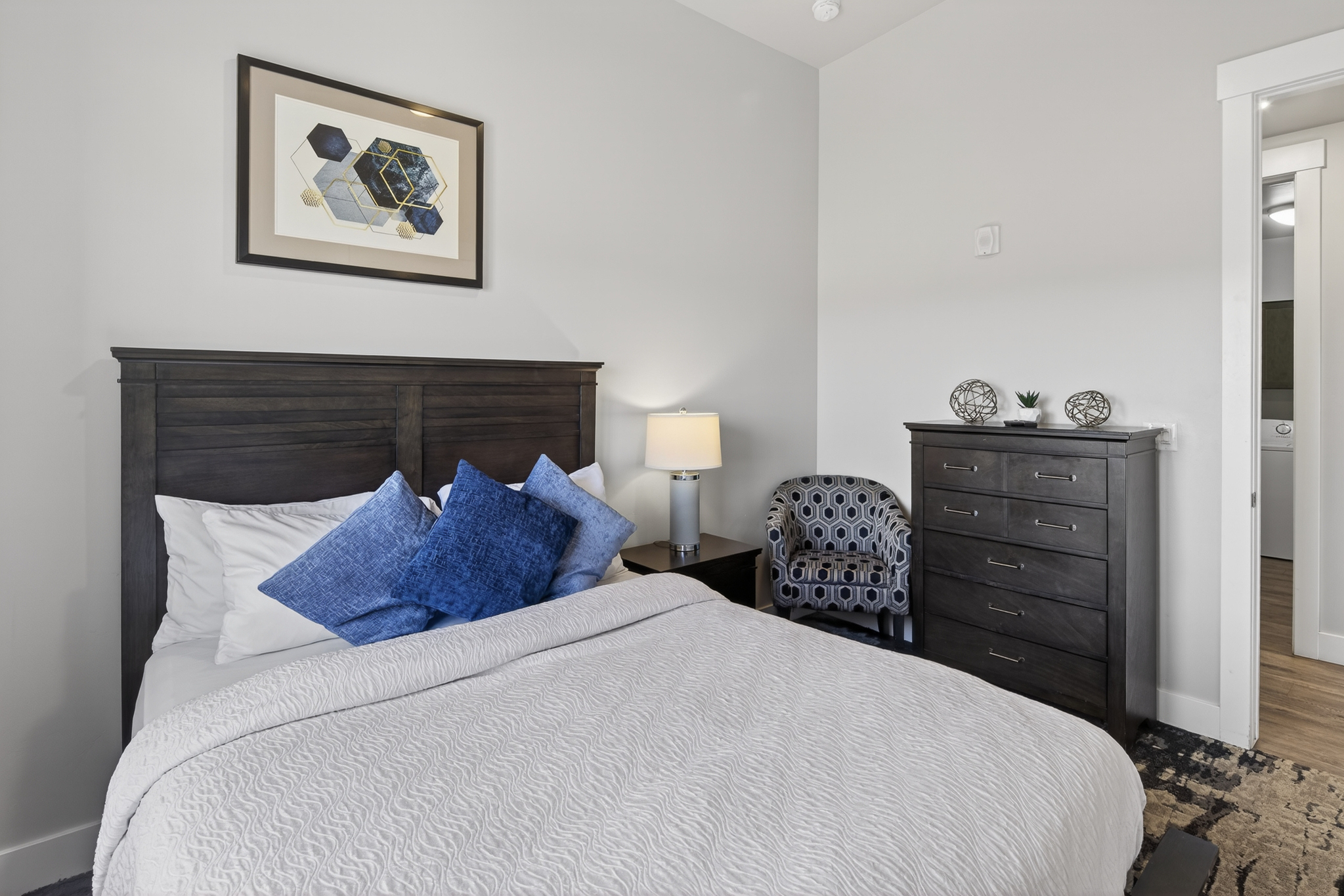 Relax and recharge in this cozy queen bedroom retreat.
