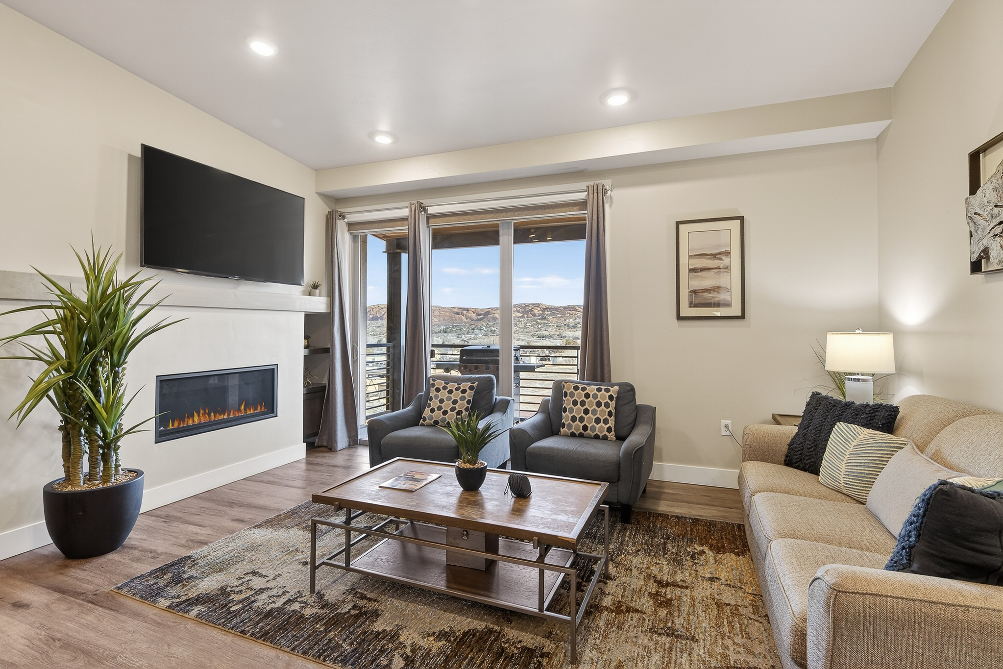 Bright, airy great room with direct access to the private balcony and sweeping views.