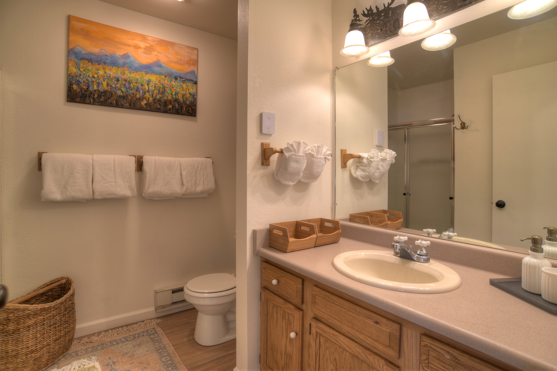 Bathroom vanity with ample counter space and storage – modern fixtures and plenty of room for your toiletries.