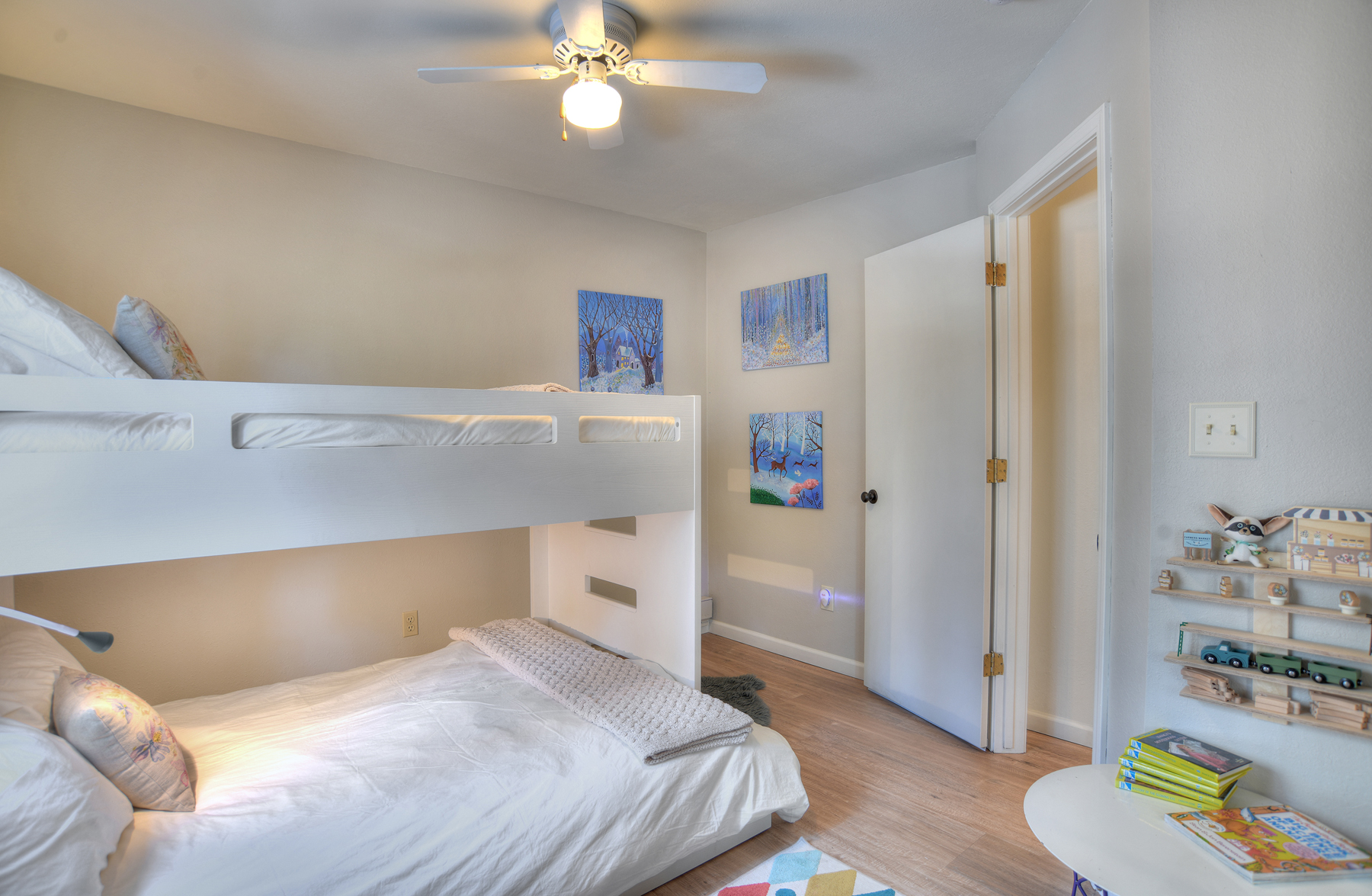 Bedroom 2 with twin-over-full bunk bed and Smart TV – sleeps three guests comfortably, perfect for kids or friends traveling together.