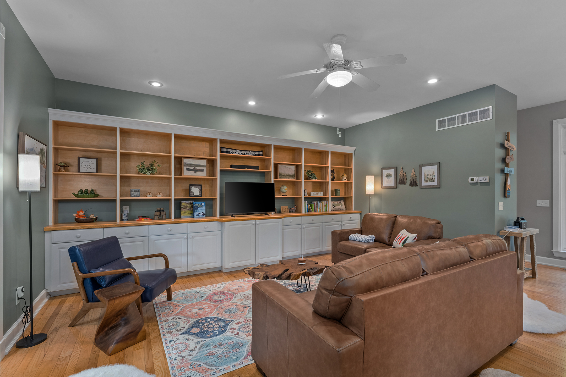 Cozy living area with built-in shelving and comfortable seating – the second of two living rooms, ideal for multiple groups or families to relax separately.