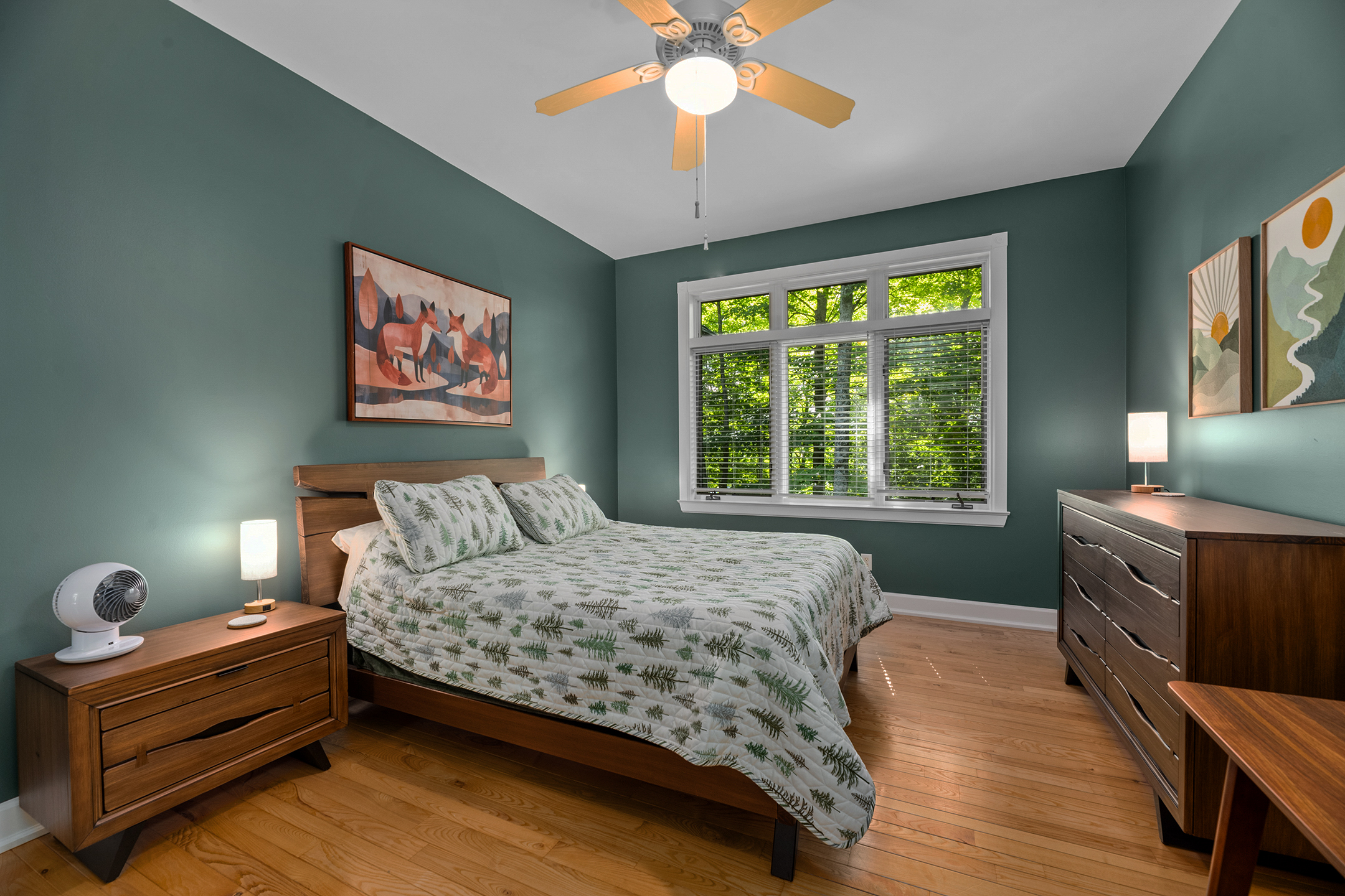 Charming bedroom with lake views and modern touches – wake up to beautiful views of Little Martha Lake each morning.