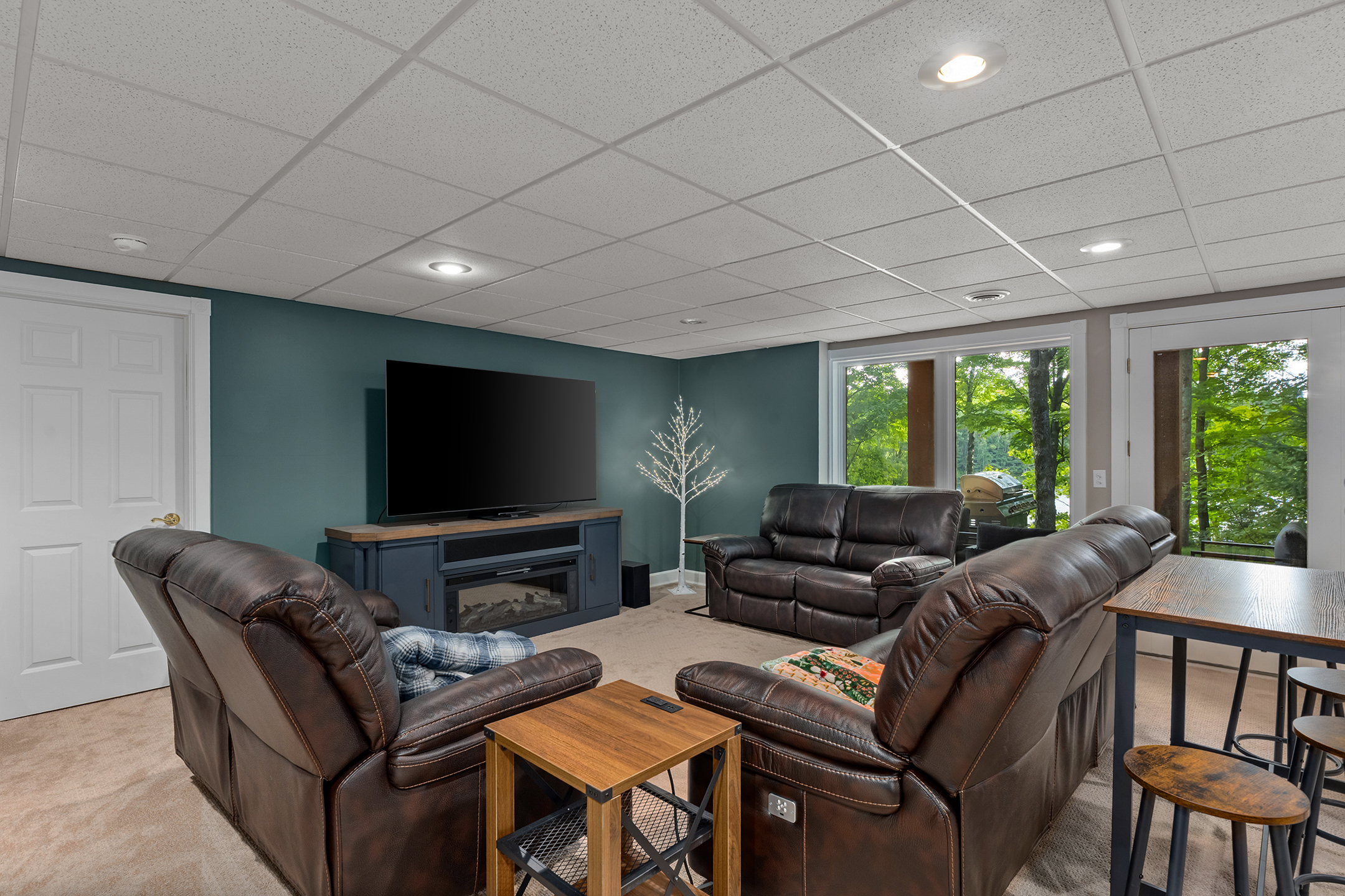Spacious living room with ample seating – one of two living areas perfect for gathering, relaxing, and entertaining. Enjoy movie nights or simply unwind in comfort.