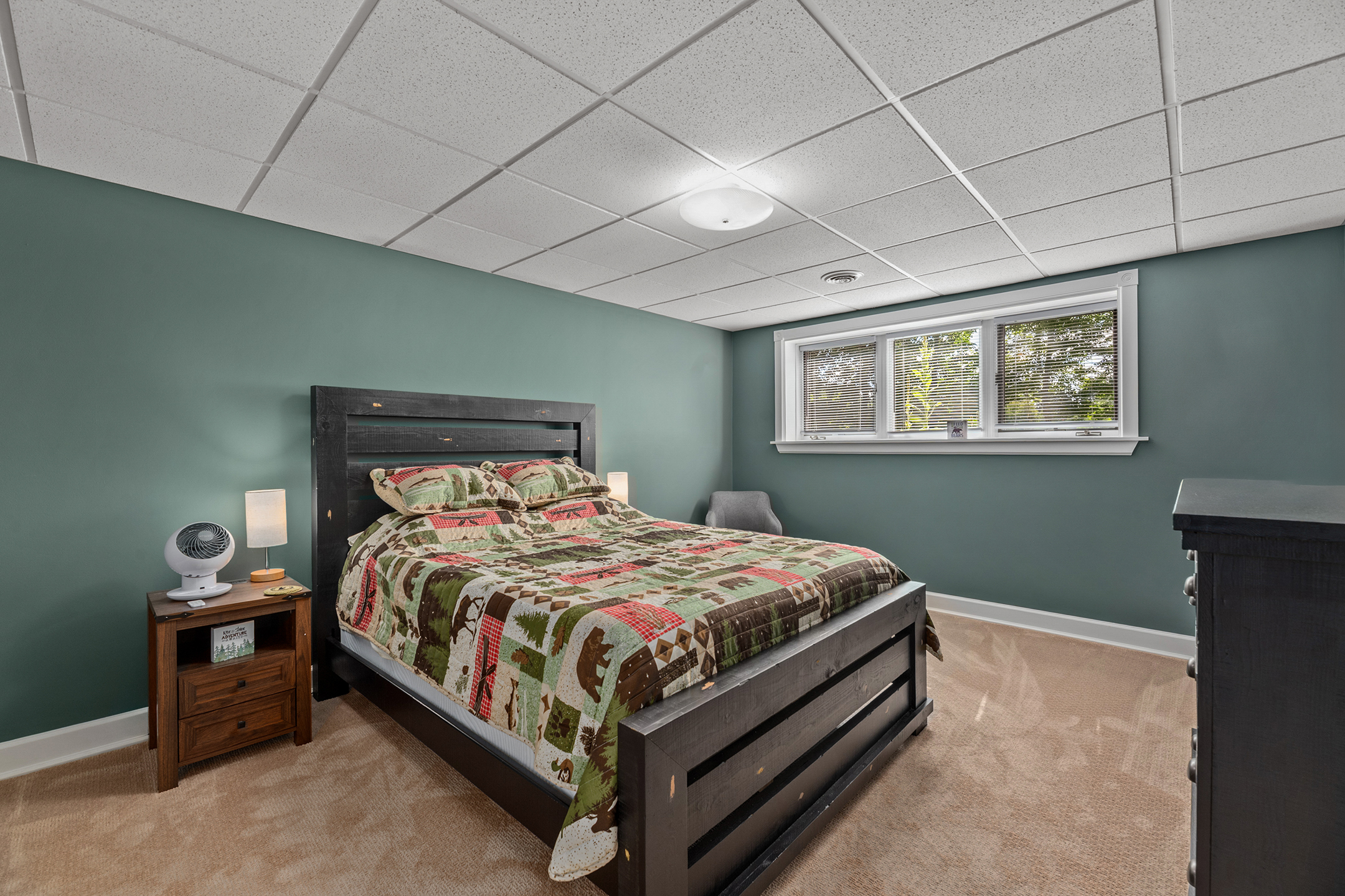 Lower-level bedroom with two comfortable queen beds – sleeps four guests, perfect for families or friends traveling together.