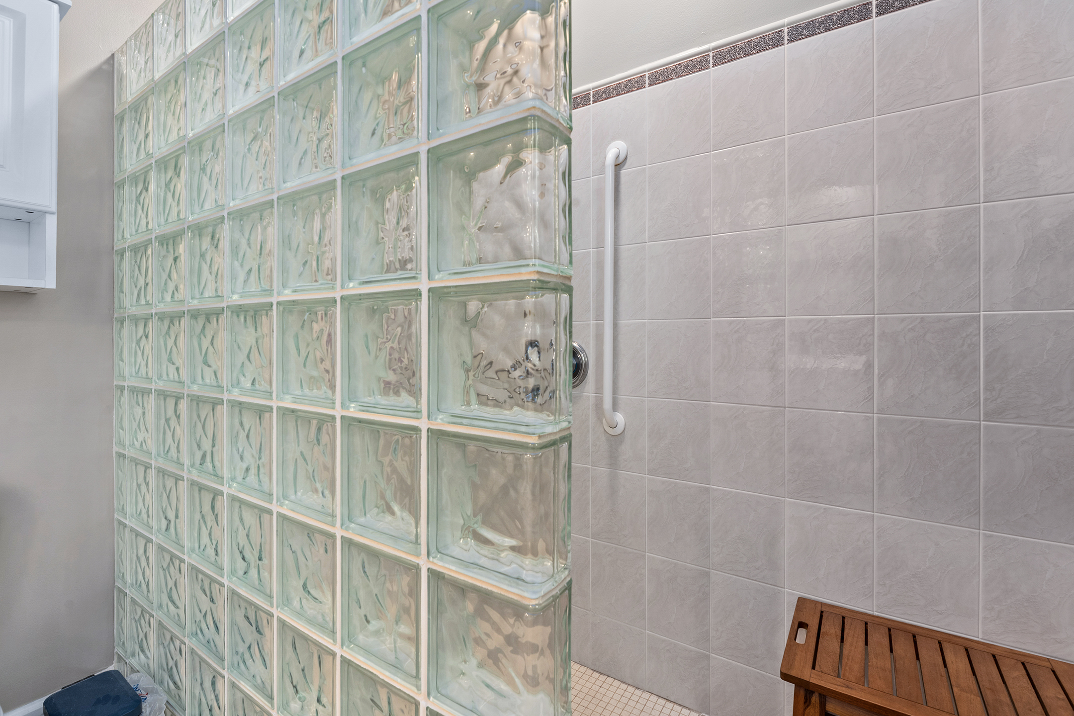 Clean and modern bathroom with tiled shower – plenty of space and updated amenities for your comfort.