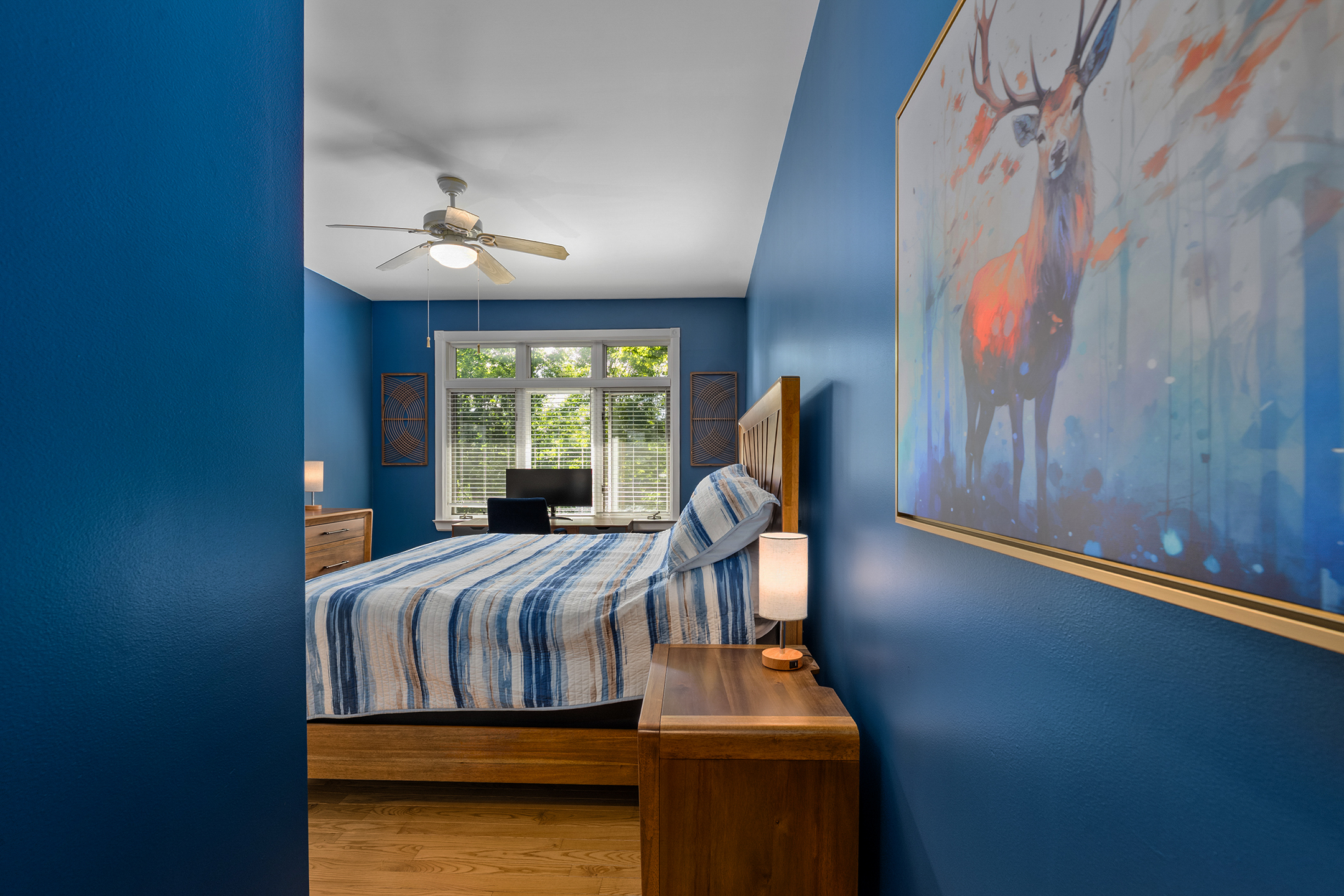 Stylish bedroom with comfortable accommodations and peaceful ambiance – designed for restful sleep and relaxation in the Northwoods.