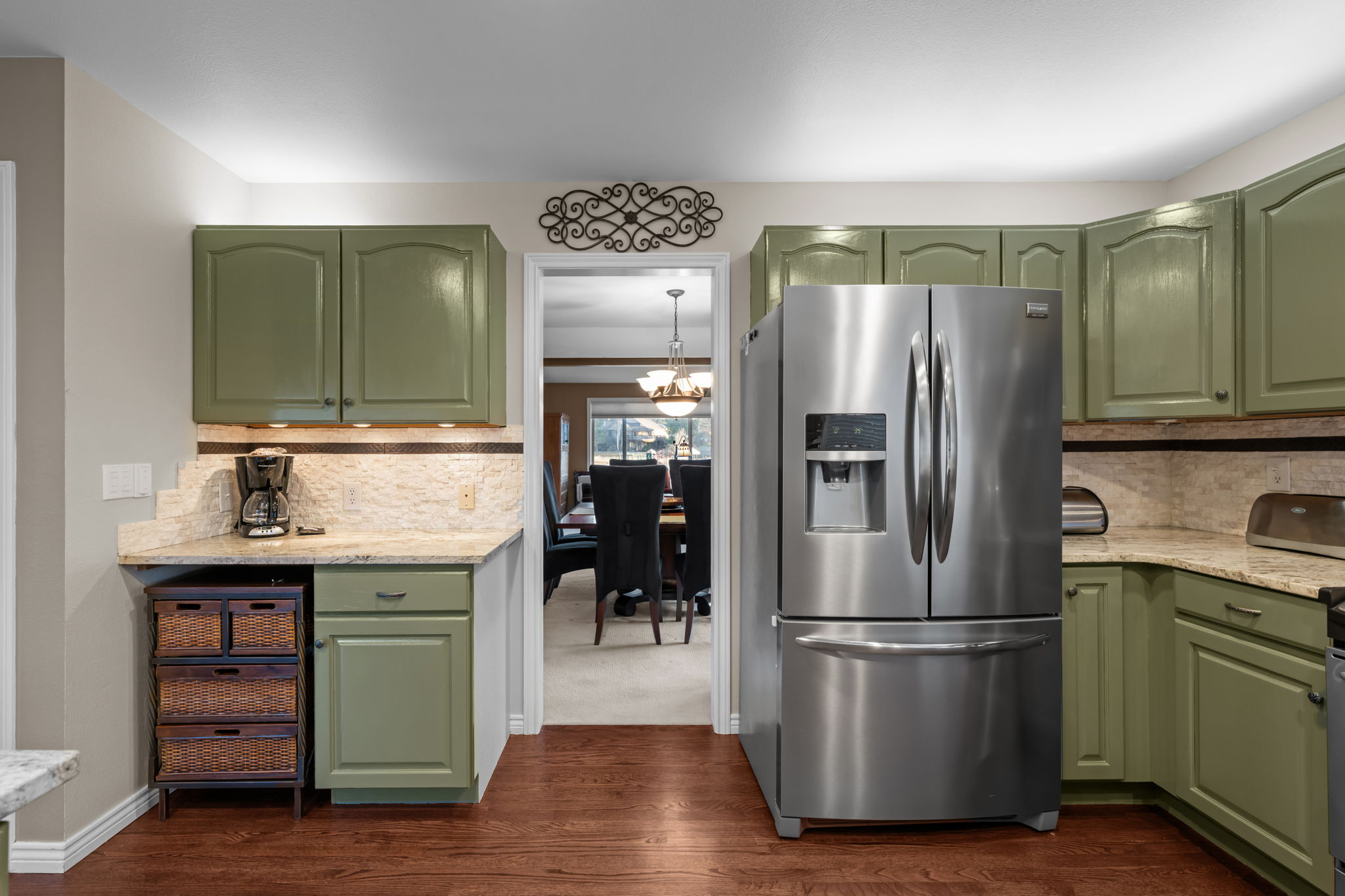 Well-equipped kitchen with stainless appliances, ample cabinetry, and open sightlines.