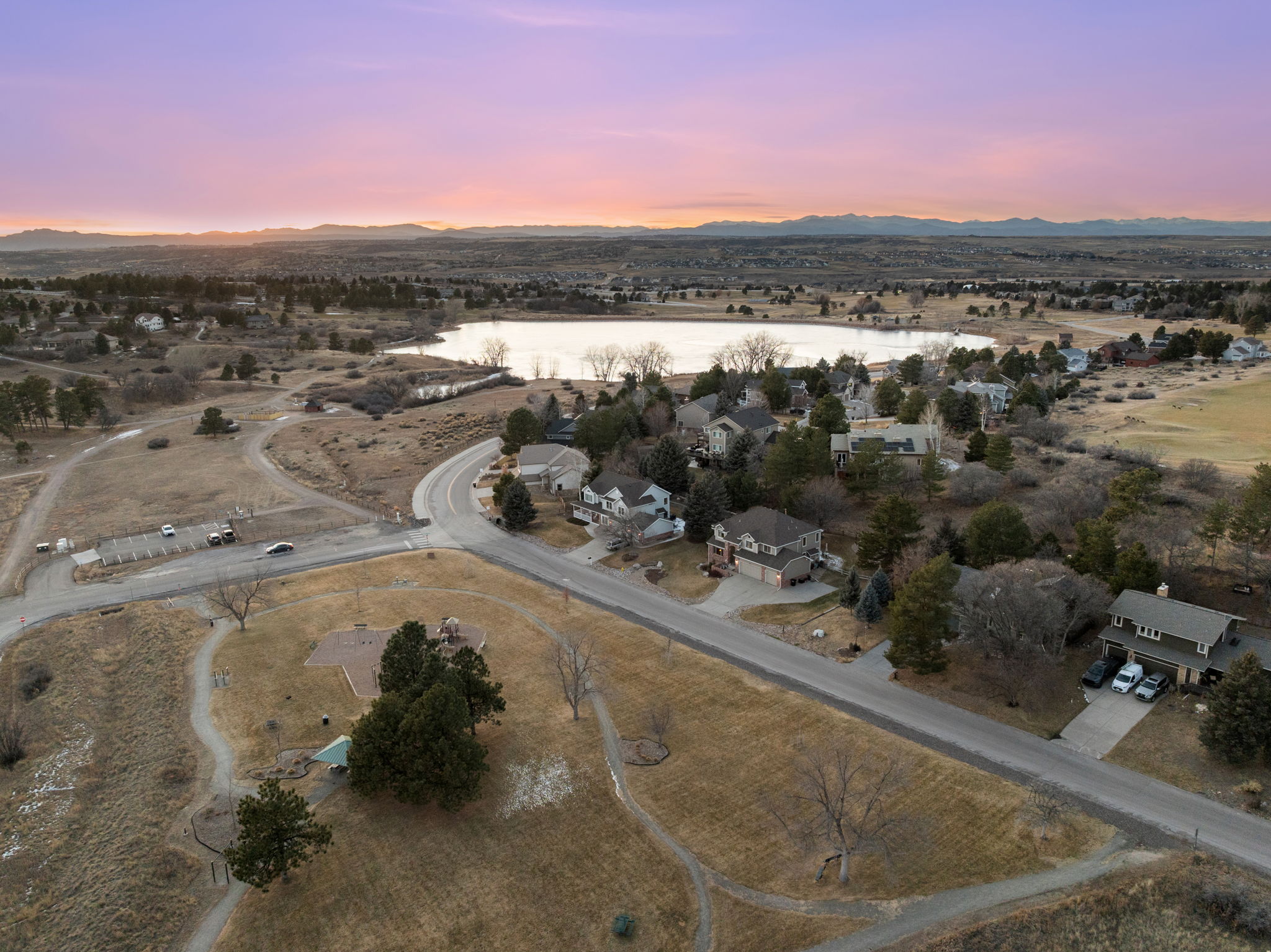Aerial view of the peaceful Lakeshore community with scenic mountain backdrop