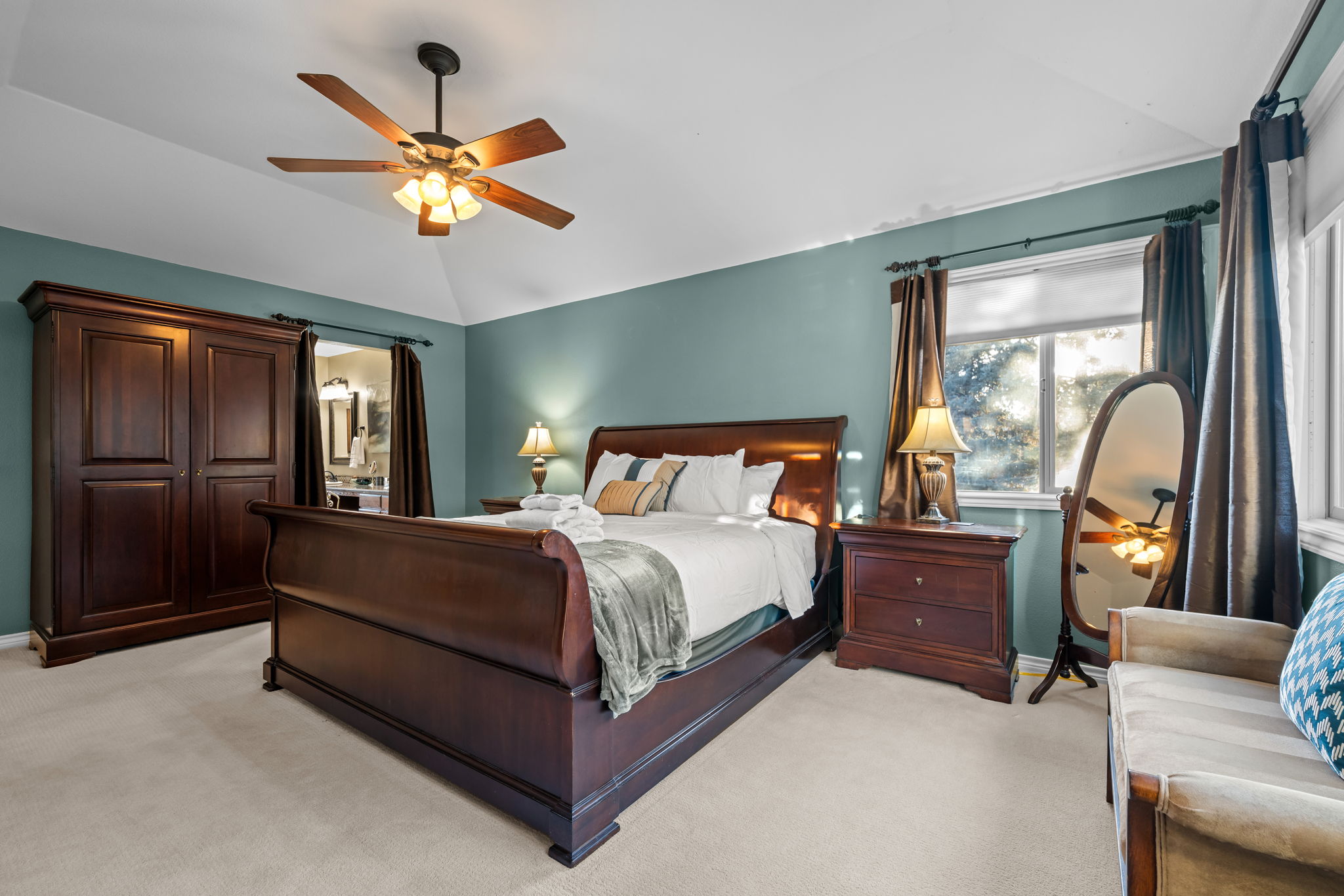 Primary bedroom retreat with walk-in closet and spa-like ensuite bathroom.