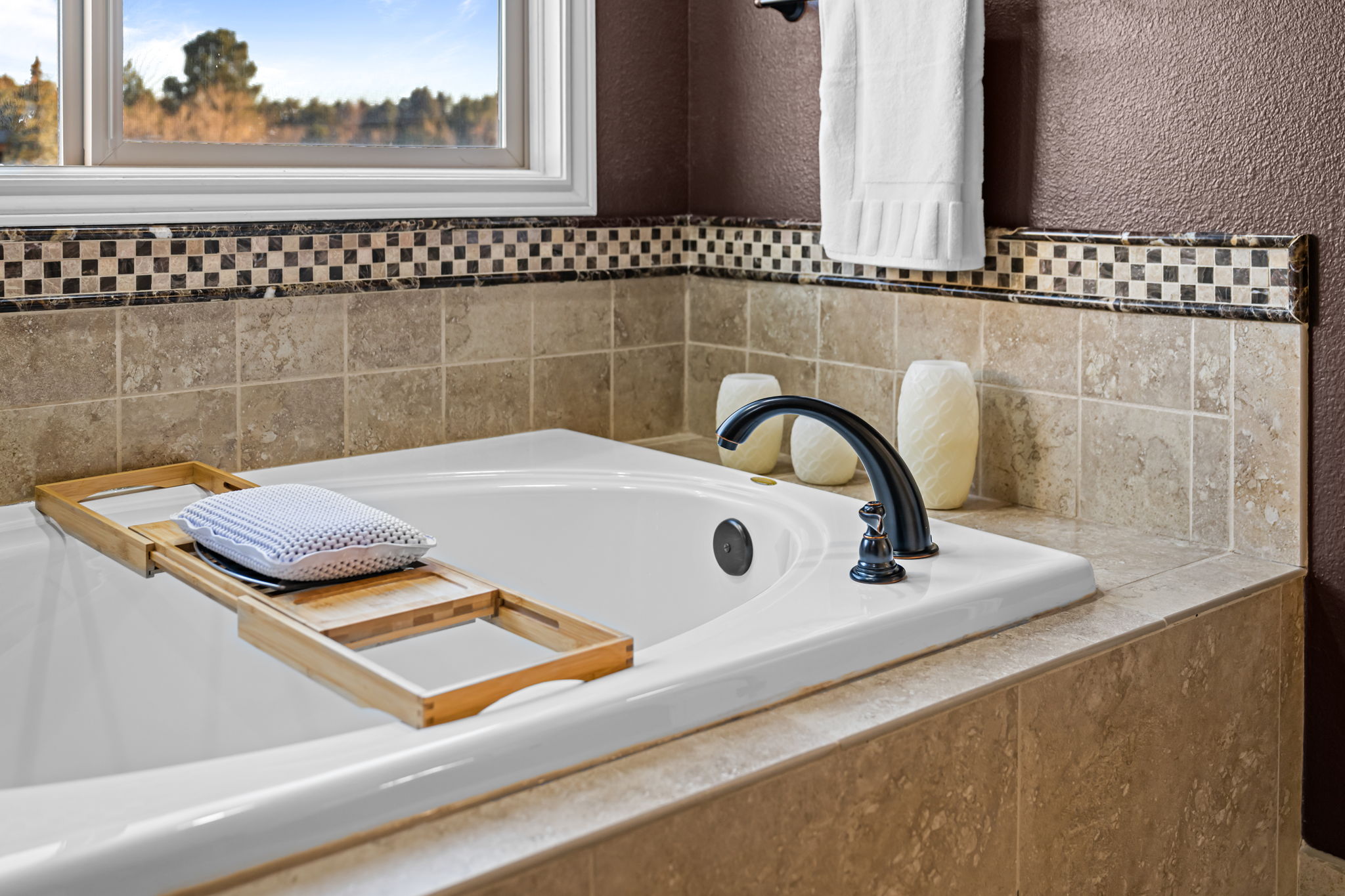 Third bedroom with two single beds—perfect for kids or guests.Spacious deck with outdoor dining area—ideal for grilling and entertaining.