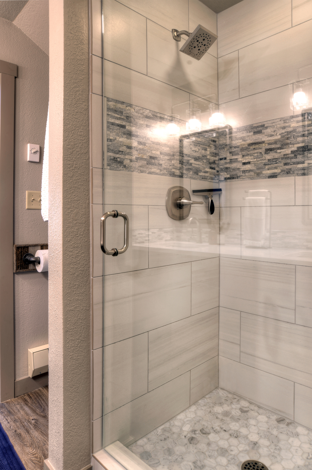 Full bathroom featuring a sleek walk-in shower.
