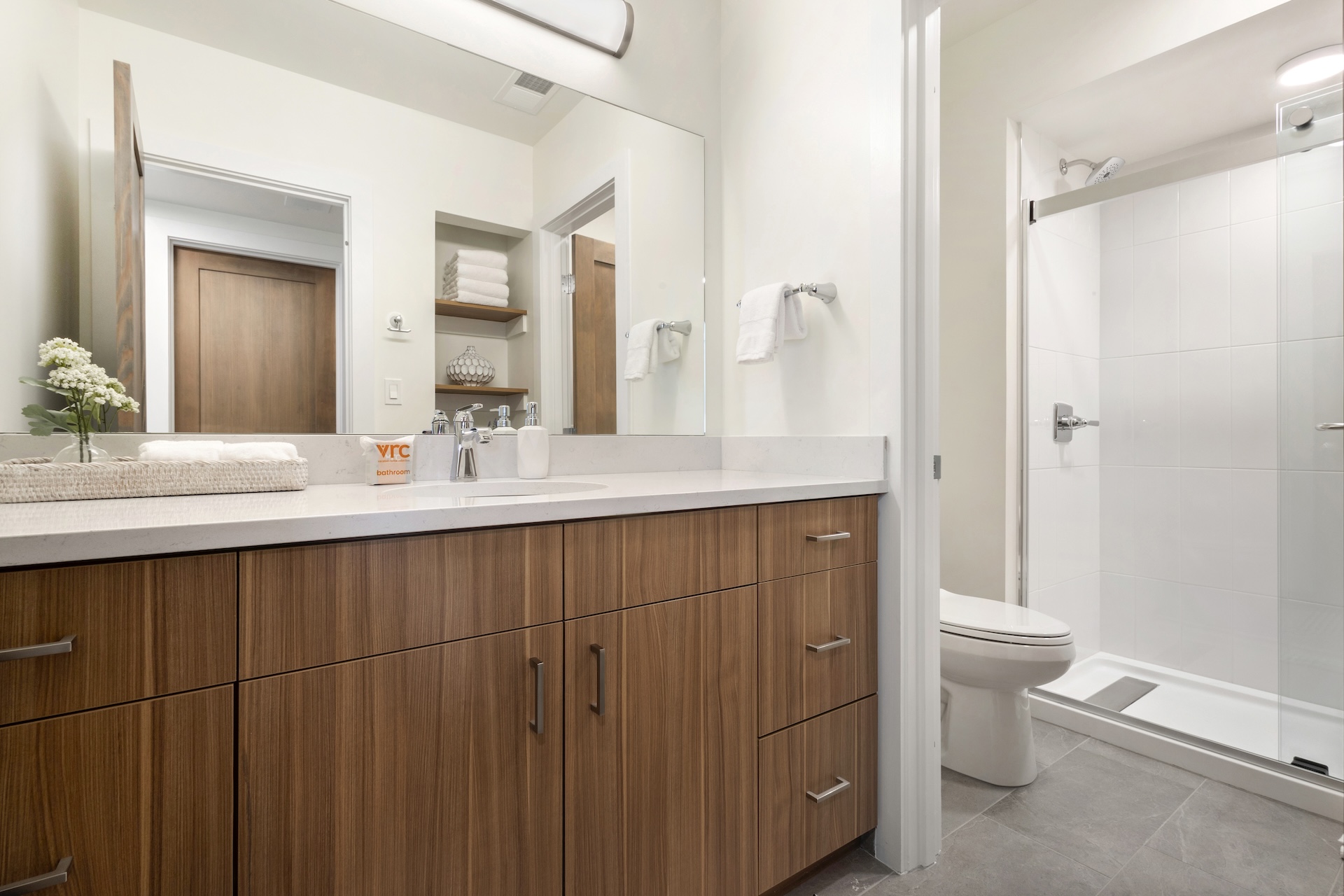 Full bathroom featuring a sleek walk-in shower.
