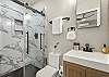 Full bathroom featuring a sleek walk-in shower.
