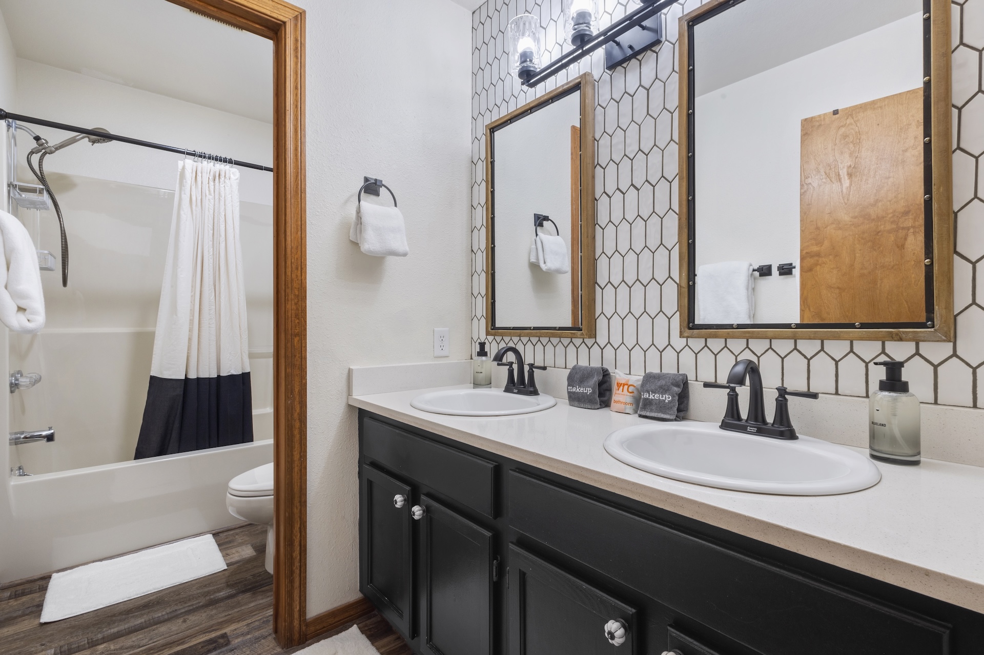 Spacious bathroom with tub and shower combo for added flexibility.
