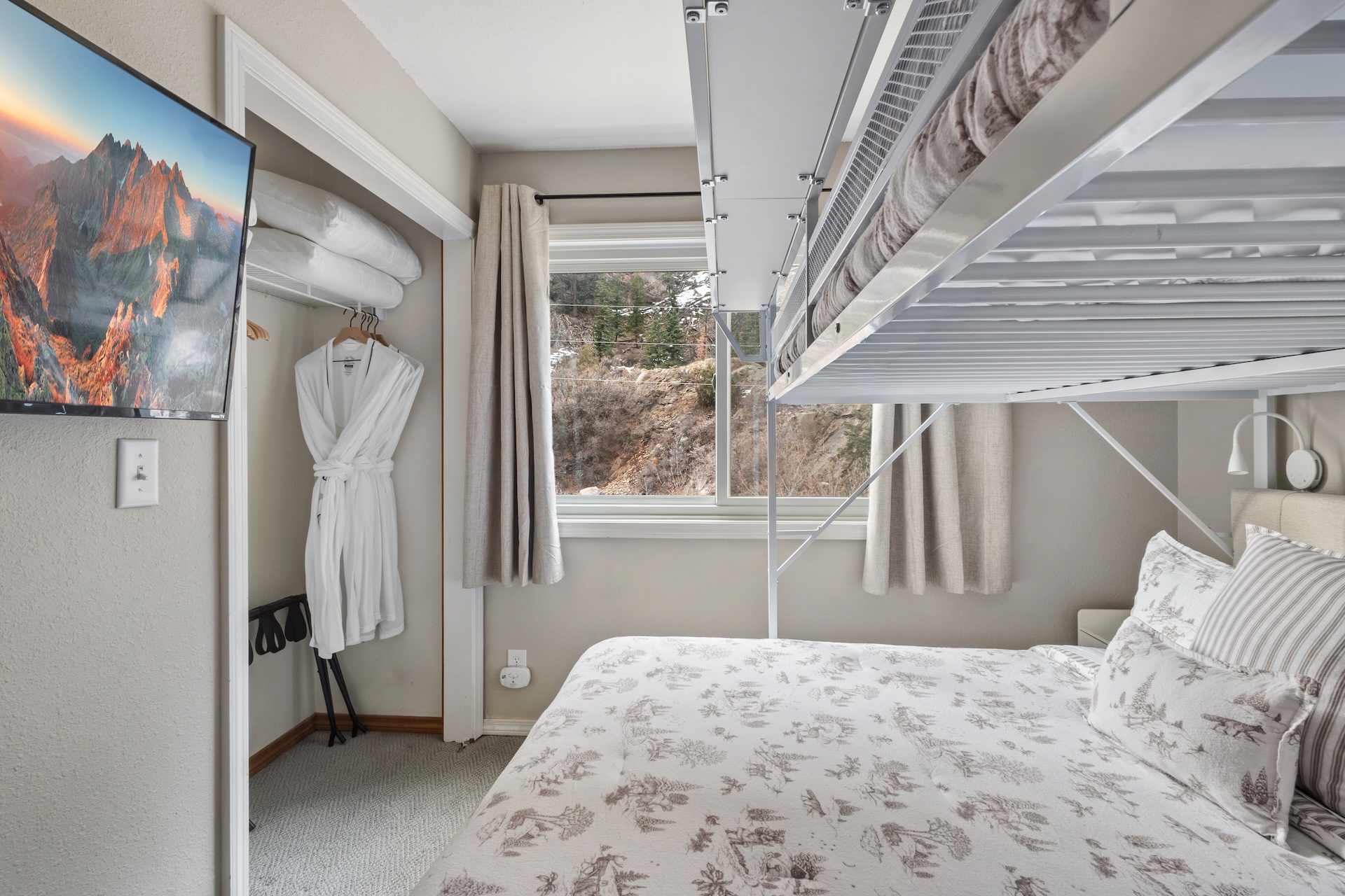 Bedroom #2 features a Queen over Queen bunk bed and Smart TV