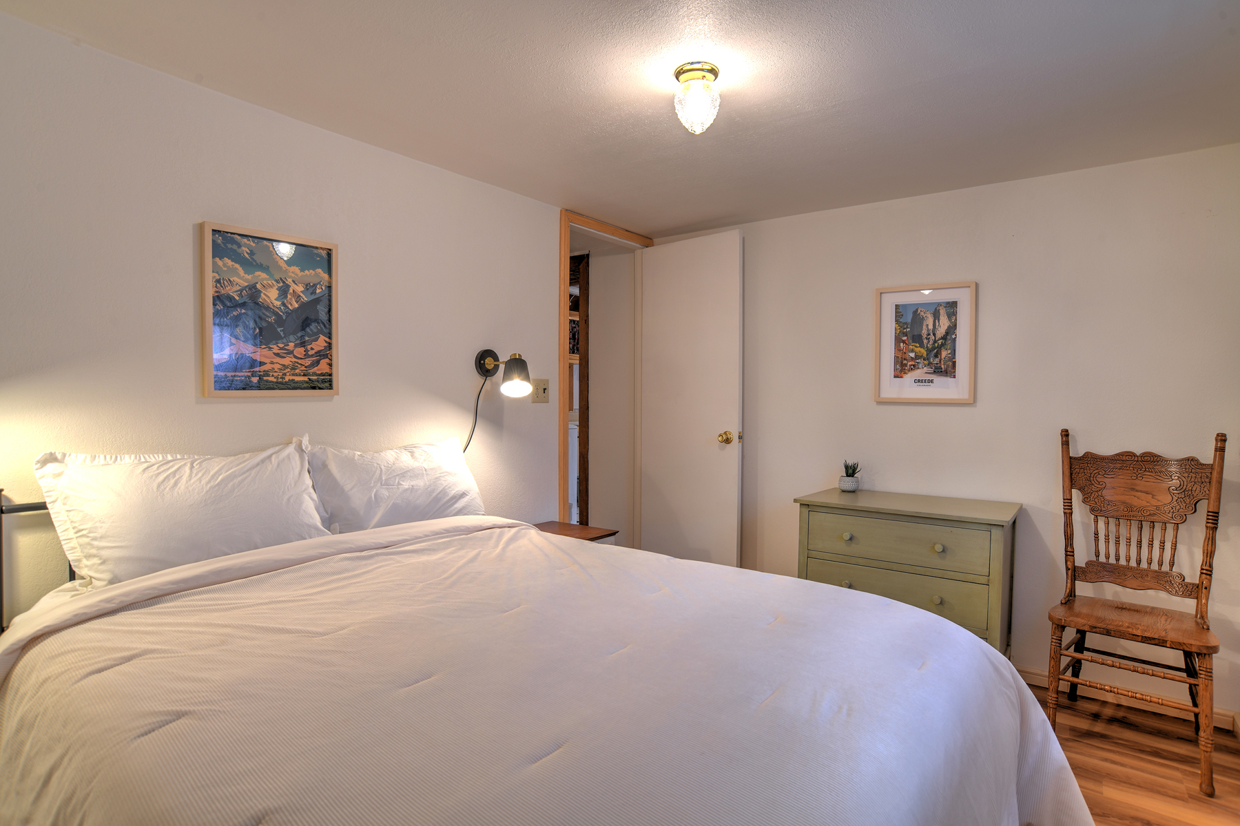 Third bedroom on the main level featuring a queen bed. 