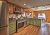 Fully equipped kitchen with stainless steel appliances.