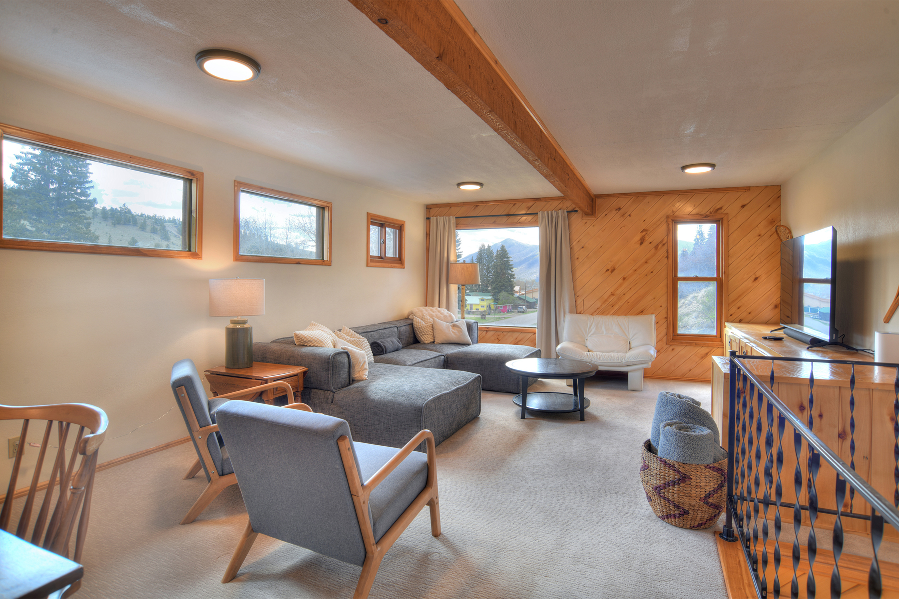 Upstairs living area equipped with comfortable seating and a Smart TV.