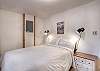 Third bedroom on the main level featuring a queen bed. 