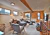 Upstairs living area equipped with comfortable seating and a Smart TV.