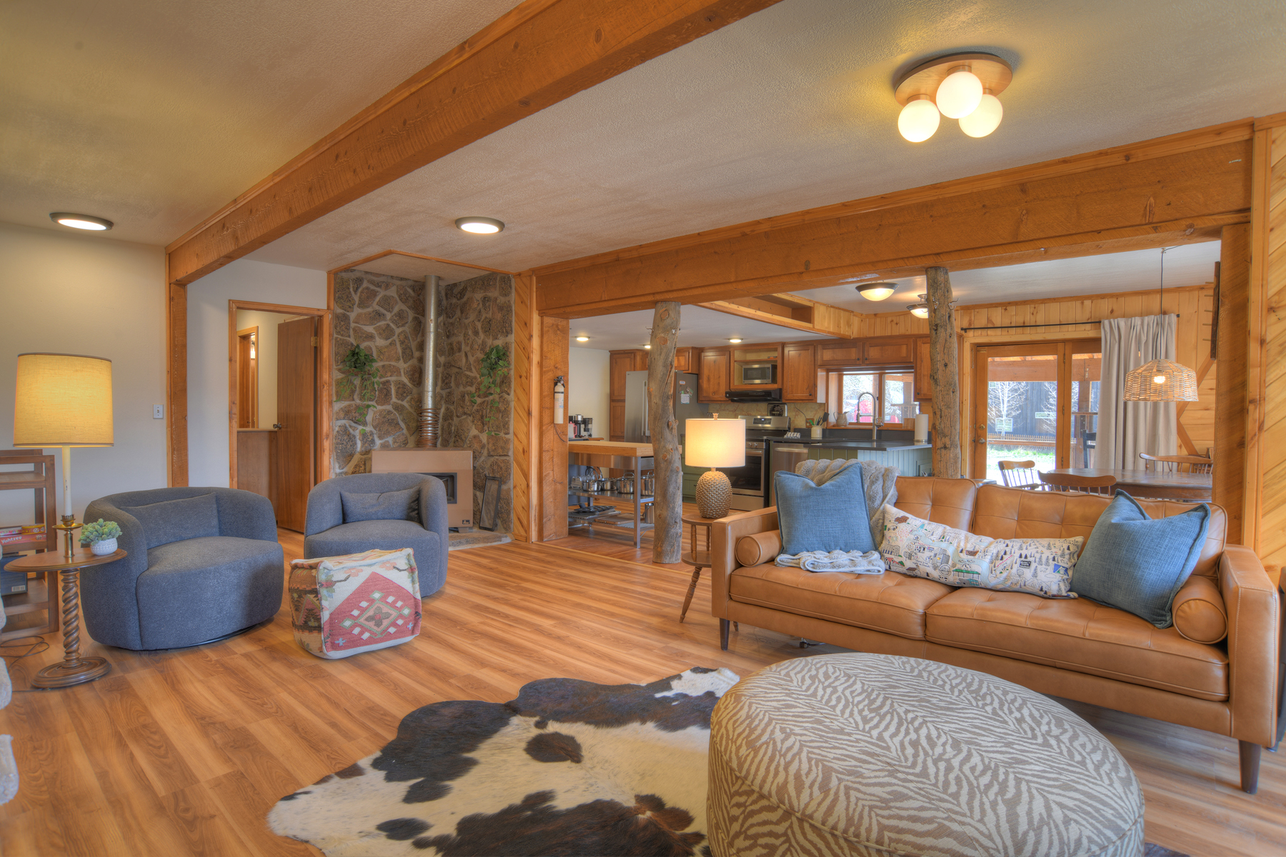 Open-concept living room that flows seamlessly into the kitchen and dining area.