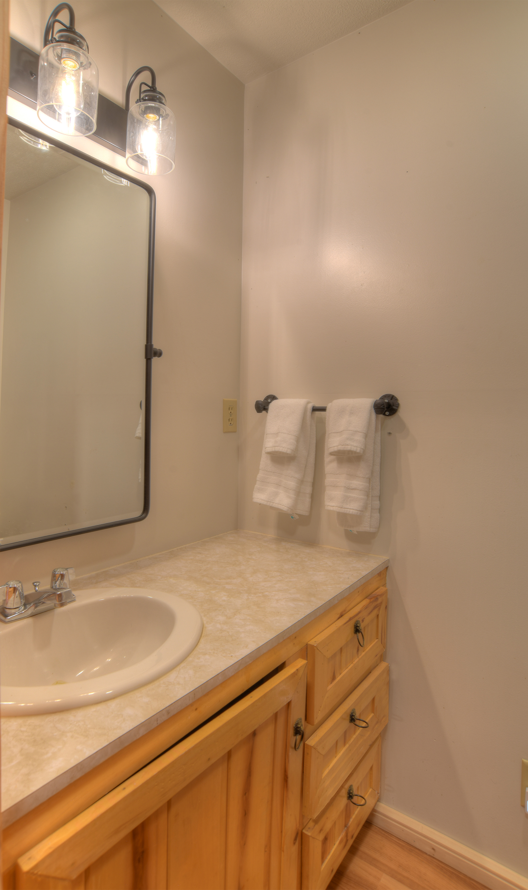 Private half-bath ensuite for second bedroom.