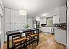 The spacious kitchen includes high top seating for 4. 