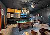 Play a game of billiards in this custom designed garage space with a pool table and large Smart TV.