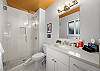 Full bathroom featuring a sleek walk-in shower.