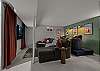 The basement theater/game room includes a big screen, comfortable seating, fooseball, air hockey, and Skee-Ball