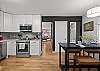 The spacious kitchen includes high top seating for 4. 