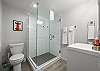 Full bathroom featuring a sleek walk-in shower.