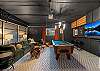 Play a game of billiards in this custom designed garage space with a pool table and large Smart TV.