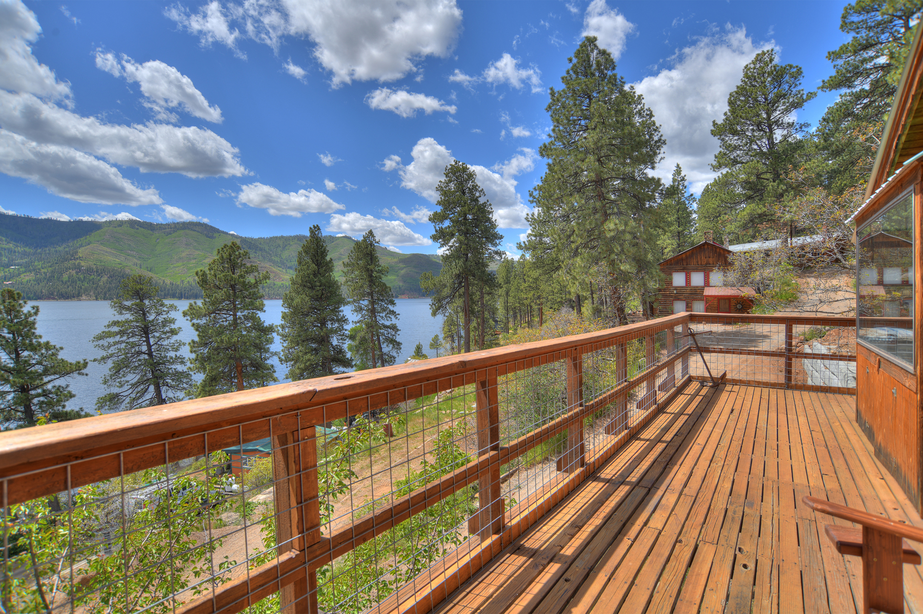 Step out onto the deck and see stunning lakefront and mountain views of Lake Vallecito.