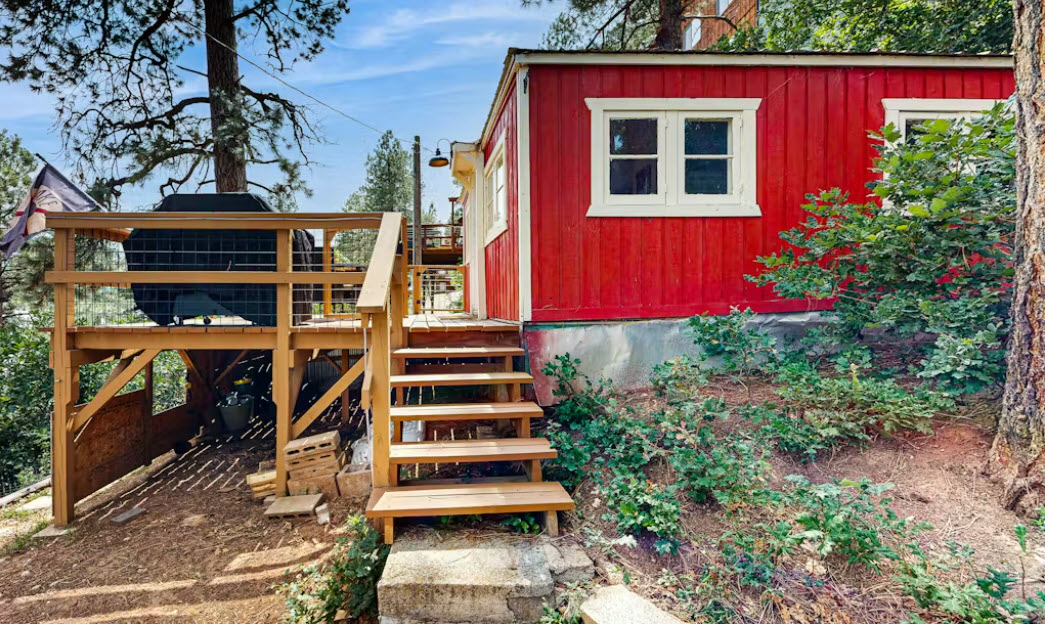 Exterior Staircase that leads to Deck Access with Mountain and Lake Views