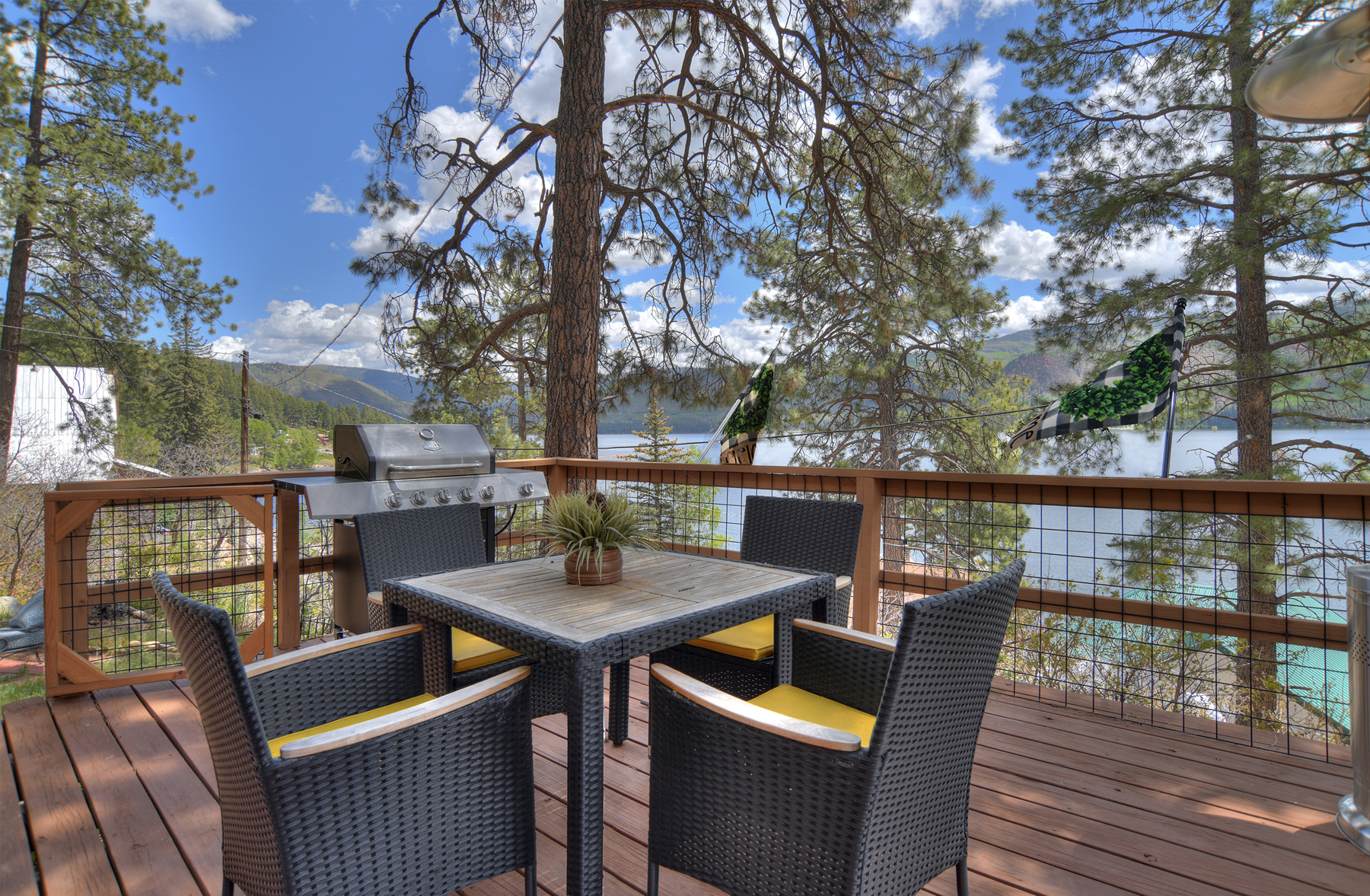 Relax, grill, and take in the lake and mountain views from the private deck. 