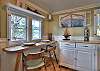 Well equipped kitchenette with lake house charm - seating for 2. 