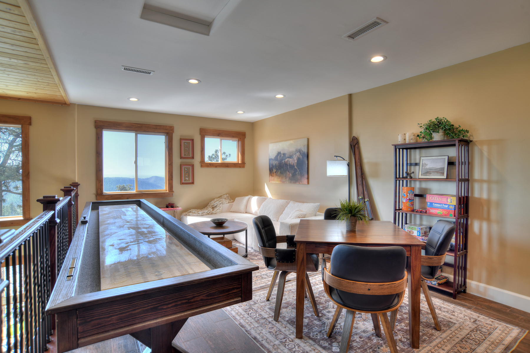 Loft Game Room with Shuffleboard, games and seating