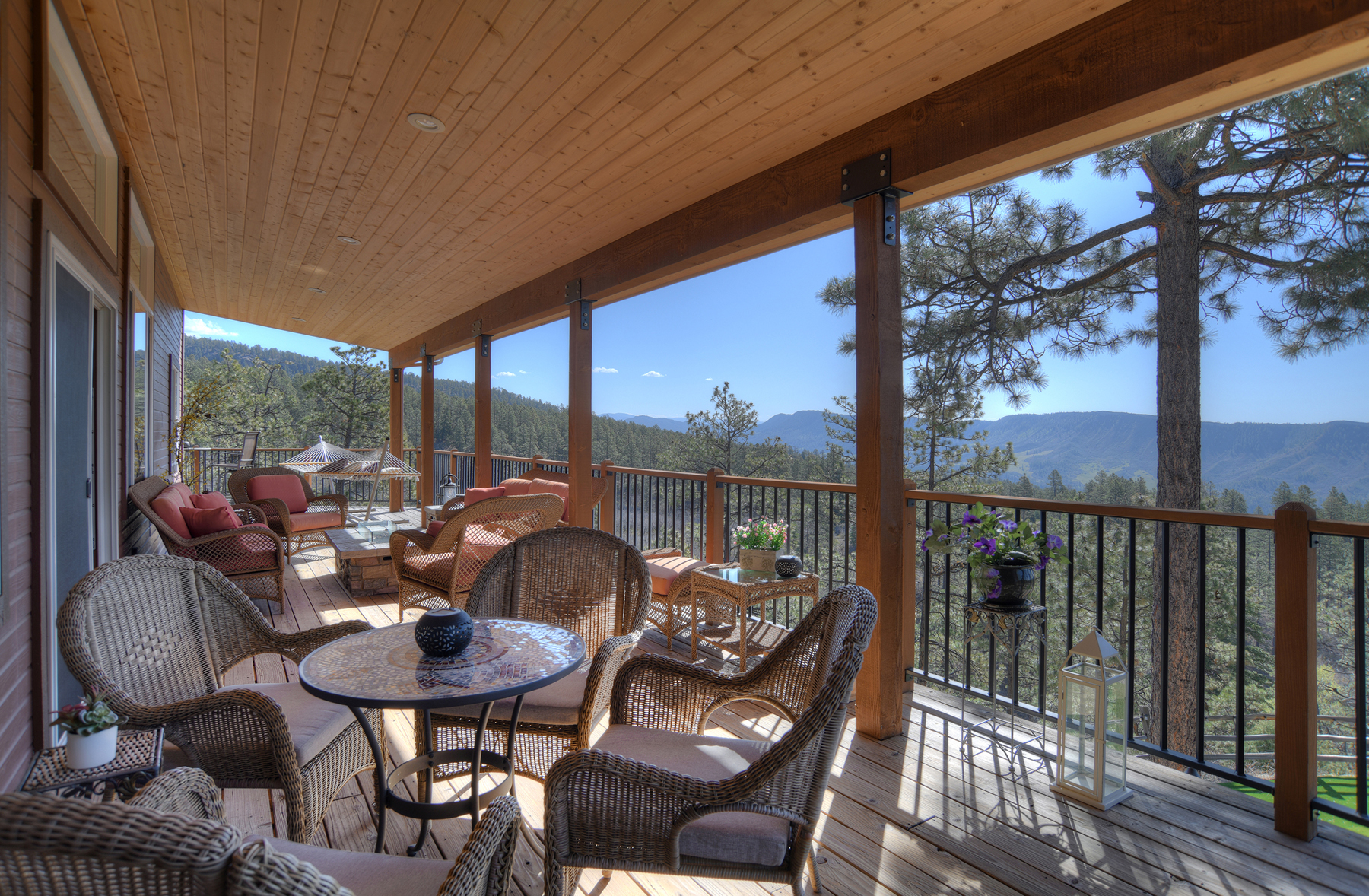 Covered deck off the Main Living Space with amazing views (gas fire table and hammock) 
