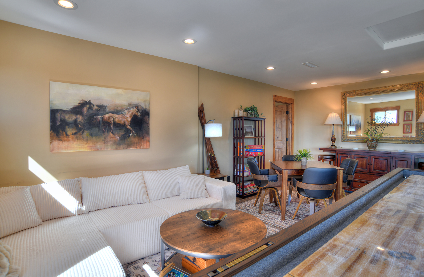 Loft Game Room with Shuffleboard, games and seating