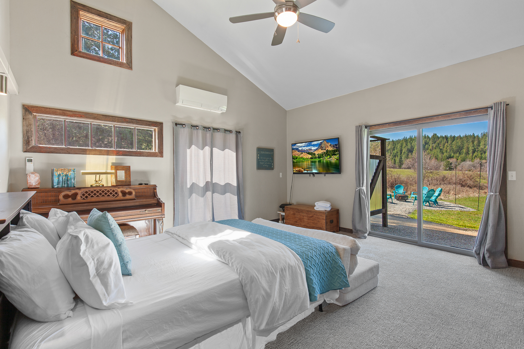 Bright queen room on the main floor with convenient patio access.